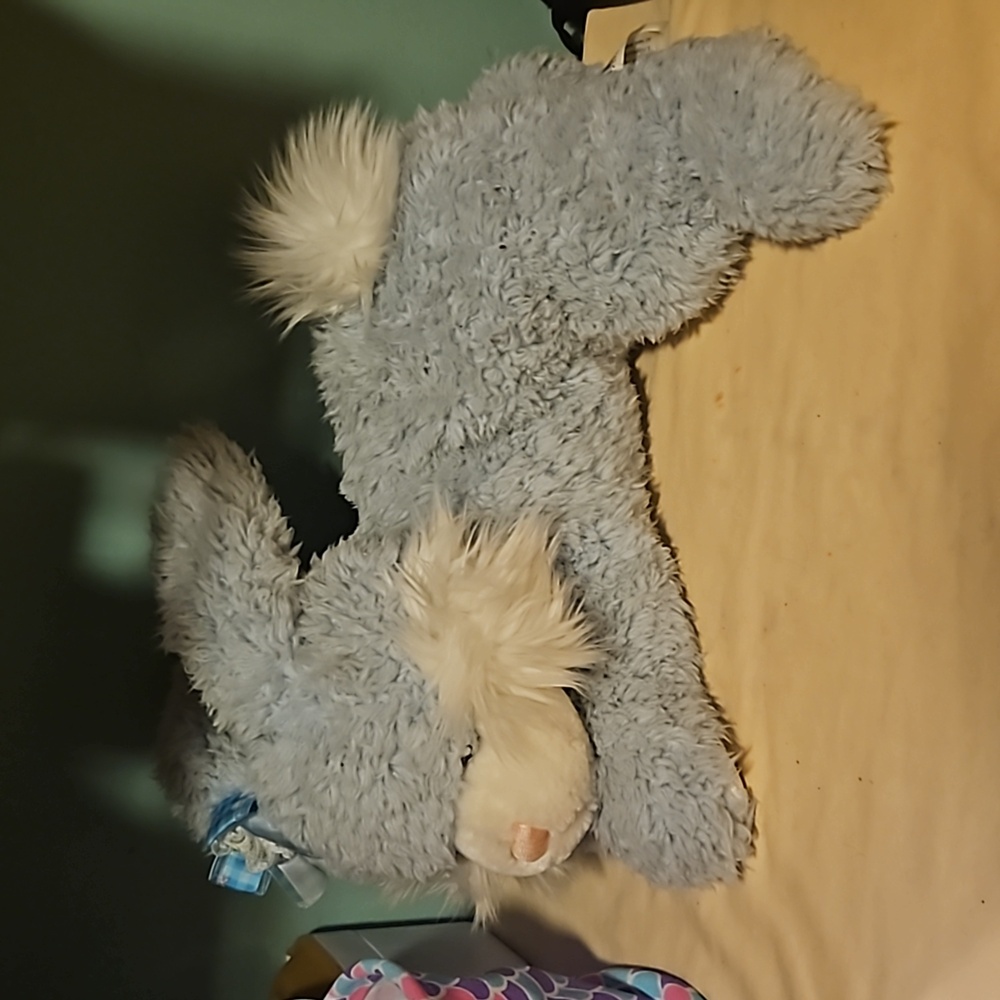 Blue stuffed bunny with blue bow